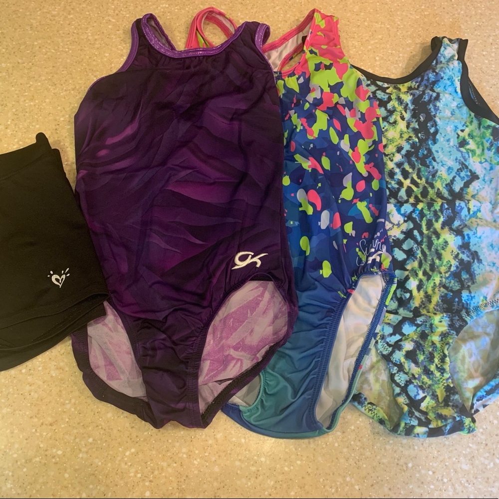 3 adult small leotards and black Justice shorts